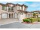 Two-story townhome with Mediterranean styling, landscaped grounds, and attached garage at 19 Via Visione # 204, Henderson, NV 89011