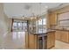 Island kitchen with granite countertops and stainless steel appliances at 19 Via Visione # 204, Henderson, NV 89011