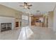 Open concept kitchen and living area with tile floors and island at 19 Via Visione # 204, Henderson, NV 89011