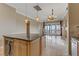 Open living area with fireplace, tile floors and access to balcony at 19 Via Visione # 204, Henderson, NV 89011