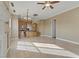 Open concept living room and kitchen with light cabinetry at 19 Via Visione # 204, Henderson, NV 89011