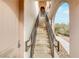 Exterior stairs leading to a private entrance with wrought iron railings at 19 Via Visione # 204, Henderson, NV 89011