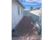 Side yard with gravel landscaping and a gate at 1905 Weldon Pl, Las Vegas, NV 89104