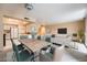 Virtually staged dining area adjacent to kitchen, featuring a wood table and teal chairs at 205 E Harmon Ave # 409, Las Vegas, NV 89169