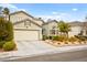 Two-story house with attached garage and landscaped yard at 2250 Tedesca Dr, Henderson, NV 89052