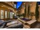 Private backyard with hot tub and seating area at 2448 Granada Bluff Ct, Las Vegas, NV 89135