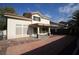 Spacious backyard featuring a covered patio and red tile patio at 3390 Syvella Ct, Las Vegas, NV 89117