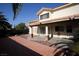 Backyard with covered patio, and a large red tile patio at 3390 Syvella Ct, Las Vegas, NV 89117