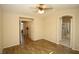 Bright bedroom with wood-look floors and access to bathroom at 3390 Syvella Ct, Las Vegas, NV 89117