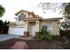 Two-story house with a two-car garage and landscaping at 3390 Syvella Ct, Las Vegas, NV 89117