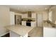 Kitchen with granite counters, stainless steel appliances, and an island at 3390 Syvella Ct, Las Vegas, NV 89117