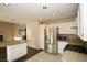 Kitchen boasts granite countertops, stainless steel appliances, and an island at 3390 Syvella Ct, Las Vegas, NV 89117