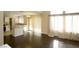 Open floor plan kitchen and dining area, featuring an island and dark hardwood floors at 3390 Syvella Ct, Las Vegas, NV 89117