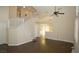 High-ceiling living room with a view of the staircase and kitchen at 3390 Syvella Ct, Las Vegas, NV 89117
