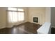 Living room with fireplace and dark hardwood floors at 3390 Syvella Ct, Las Vegas, NV 89117