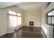 Living room with dark hardwood floors, fireplace, and large windows at 3390 Syvella Ct, Las Vegas, NV 89117