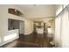 Bright living room with high ceilings, and views of the kitchen and staircase at 3390 Syvella Ct, Las Vegas, NV 89117