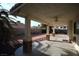 Covered patio with ceiling fan, brick columns, and access to backyard at 3390 Syvella Ct, Las Vegas, NV 89117