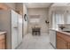 Kitchen features a breakfast nook and white appliances at 3975 N Hualapai Way # 266, Las Vegas, NV 89129