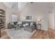Open living room with high ceilings, hardwood floors, and a comfortable sectional sofa at 3975 N Hualapai Way # 266, Las Vegas, NV 89129
