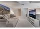 Open loft space, featuring a large sectional couch and big screen TV at 3975 N Hualapai Way # 266, Las Vegas, NV 89129