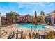 Inviting community pool with lounge chairs and umbrellas at 3975 N Hualapai Way # 266, Las Vegas, NV 89129