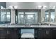 Bathroom showcasing a double vanity, modern fixtures, and tile flooring at 4269 Solace St # 0, Las Vegas, NV 89135