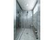 Stunning walk-in shower featuring elegant marble walls, a built-in bench, and modern fixtures at 4269 Solace St # 0, Las Vegas, NV 89135
