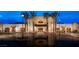 Beautifully landscaped exterior of clubhouse featuring palm trees at 4269 Solace St # 0, Las Vegas, NV 89135