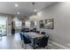 Dining room adjacent to living area with modern decor and bright lighting at 4269 Solace St # 0, Las Vegas, NV 89135