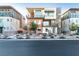 Modern three-story townhome with balconies, desert landscaping, and clean architectural lines at 4269 Solace St # 0, Las Vegas, NV 89135