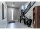 Welcoming foyer with modern staircase, stylish decor, and neutral color scheme at 4269 Solace St # 0, Las Vegas, NV 89135