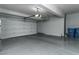 Spacious two-car garage featuring an epoxy floor and ample room for storage at 4269 Solace St # 0, Las Vegas, NV 89135