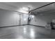 Clean and organized two-car garage with finished walls, epoxy floors, and convenient side door access at 4269 Solace St # 0, Las Vegas, NV 89135
