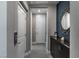 Inviting hallway showcasing modern decor, sleek cabinetry, and stylish accents at 4269 Solace St # 0, Las Vegas, NV 89135