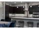 Well lit, modern kitchen with large island and bar seating open to dining area at 4269 Solace St # 0, Las Vegas, NV 89135