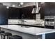 Modern kitchen with a large island, stylish backsplash, and sleek appliances at 4269 Solace St # 0, Las Vegas, NV 89135