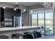 Bright modern kitchen with stainless steel appliances and access to outdoor balcony at 4269 Solace St # 0, Las Vegas, NV 89135