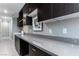 Spacious laundry room with modern cabinets, countertop space, and tiled floors at 4269 Solace St # 0, Las Vegas, NV 89135