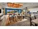 Inviting living room with striking blue accent wall, modern lighting, and seamless indoor-outdoor living at 4269 Solace St # 0, Las Vegas, NV 89135
