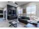 Stylish living room featuring a dark accent wall and comfortable seating at 4269 Solace St # 0, Las Vegas, NV 89135