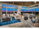 Open-concept living room and dining area with city views and modern lighting at 4269 Solace St # 0, Las Vegas, NV 89135