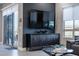 Living room featuring a sleek console table and a glass sliding door at 4269 Solace St # 0, Las Vegas, NV 89135