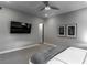 Bedroom with ceiling fan, wall-mounted TV, and natural light at 4269 Solace St # 0, Las Vegas, NV 89135