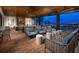 Relaxing outdoor patio with fireplace, comfortable seating, and stunning city views at 4269 Solace St # 0, Las Vegas, NV 89135