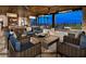 Inviting outdoor patio with fireplace, ample seating, and picturesque skyline backdrop at 4269 Solace St # 0, Las Vegas, NV 89135
