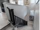 Elegant staircase with dark wood railings, plush carpet, and views of stylish wall decor at 4269 Solace St # 0, Las Vegas, NV 89135