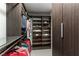 Spacious walk-in closet featuring dark wood finishes, adjustable shelves, and efficient storage solutions at 4269 Solace St # 0, Las Vegas, NV 89135