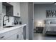 Stylish wet bar with modern fixtures and finishes, offering a convenient space next to bedroom at 4269 Solace St # 0, Las Vegas, NV 89135
