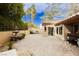 Private backyard with a fountain, spa, mature trees and an outdoor dining area at 4401 Inez Dr, Las Vegas, NV 89130